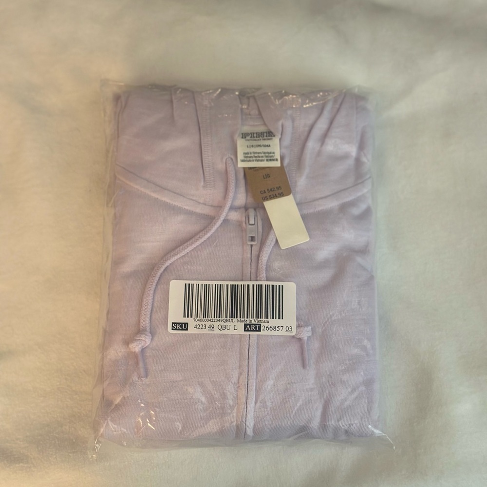 NWT brand pink color light purple size large not opened still in package